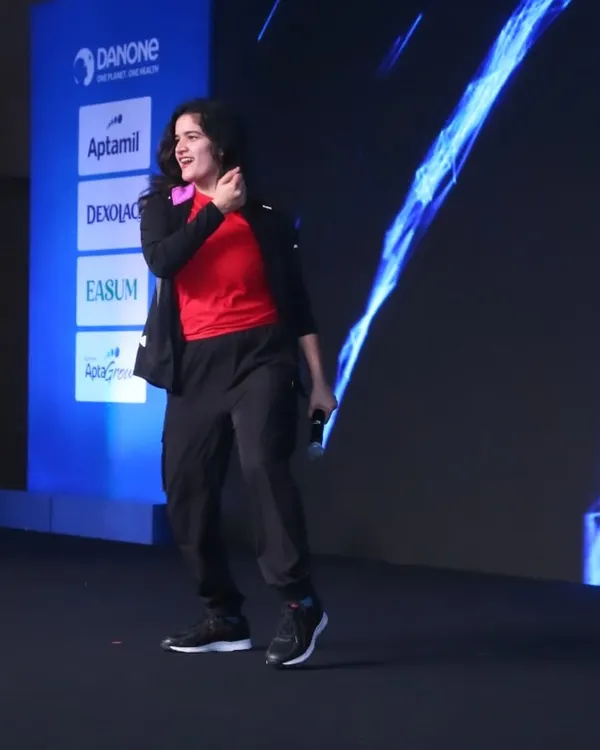 Taking the stage for a major Danone corporate event. I love commanding a large audience and creating a shared energy that fills the entire venue.