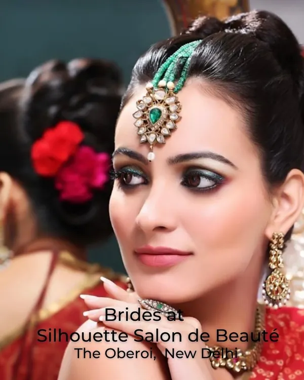 This is the quintessential bridal look I create, combining timeless tradition with flawless artistry. The focus is on creating a radiant complexion and defining the eyes to ensure you look breathtaking from the first glance to the last photograph. This look features classic kohl-rimmed eyes and a bold lip, complemented by a traditional floral hair adornment.