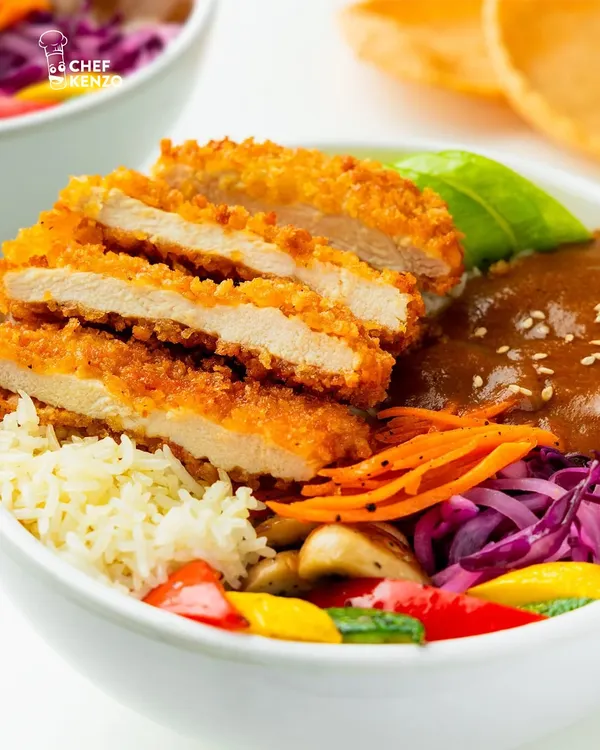 This is my Chicken Katsu Bowl. It features a perfectly crispy, golden-brown chicken cutlet served over rice with a rich, savory katsu curry sauce and a colorful mix of fresh vegetables.