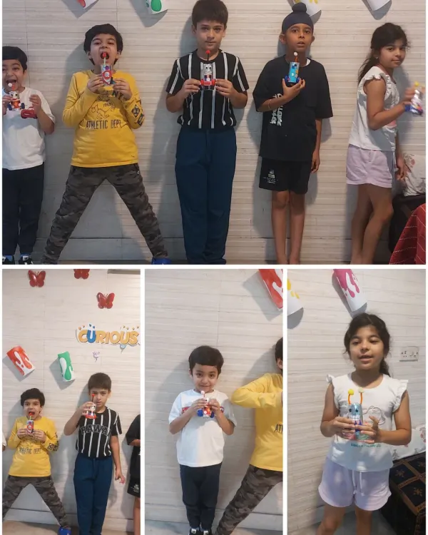 Glimpse of our session where kids made their own little robots from upcycled materials. They are proudly holding their creations, which they also named themselves!