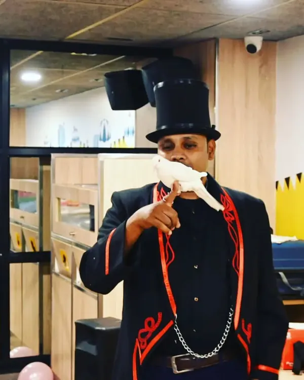 The classic dove illusion, a symbol of pure magic. This is one of my favorite effects to perform, bringing a touch of elegance and wonder to any event.