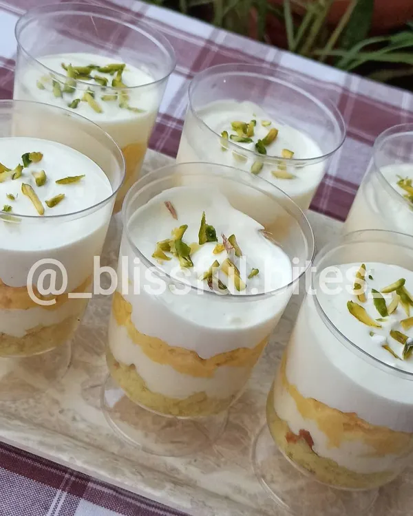 A tray of my signature Rasmalai Cake Cups. These individual desserts combine the soft texture of cake with the rich, milky flavour of traditional rasmalai.