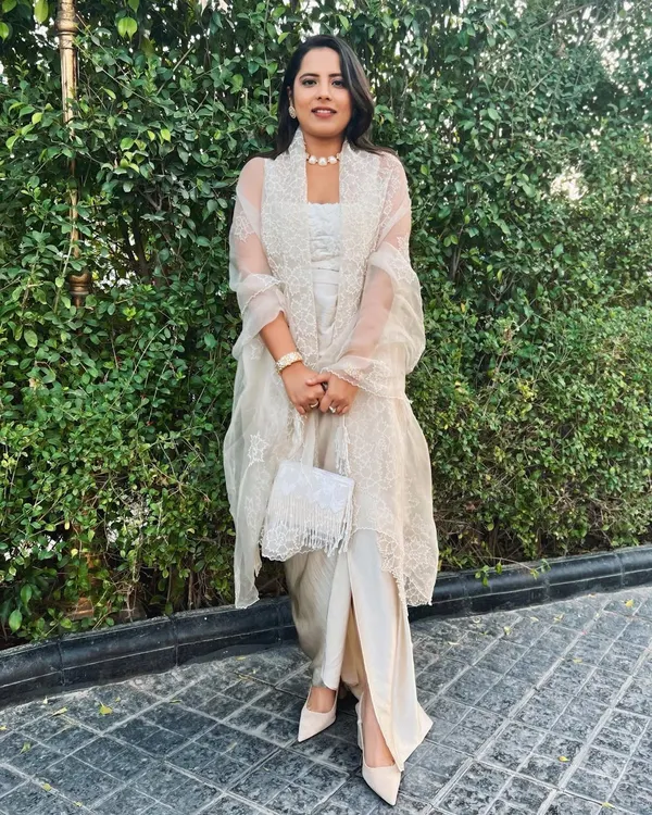 All cream everything. For a wedding, I put together this tone-on-tone look with a slit pant, crop top, and a sheer embroidered jacket.