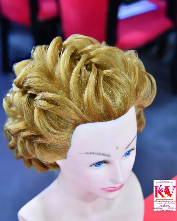 An example of an advanced Western-style updo taught in my international hairstyling classes. This voluminous, curled style is perfect for a reception or engagement party.