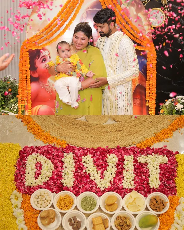 A beautiful moment from baby Divit's Annaprashan ceremony. The family gathers for a photo in front of the Krishna-Yashoda backdrop, with his name written in flowers, marking his first meal.