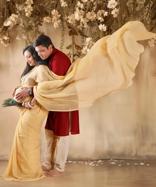 A romantic portrait for an expecting couple, surrounded by a cascade of flowers. I use flowing fabrics and soft lighting to create a dreamy, fairytale atmosphere that celebrates your connection.
