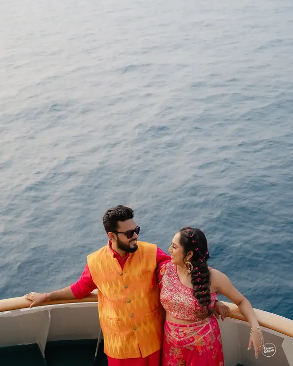 A stunning portrait from a Haldi celebration on the Cordelia Cruise, with the endless blue of the Arabian Sea as the backdrop. A truly unique destination wedding experience.