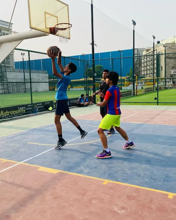 A player executes a perfect layup during a morning practice game. We drill these fundamental scoring techniques until they become second nature.