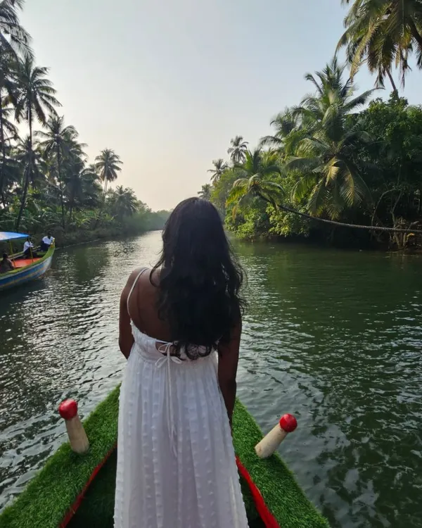 A serene moment on a boat in the beautiful backwaters of Honnavara. This mangrove forest is a hidden gem on our coastal Karnataka tour.