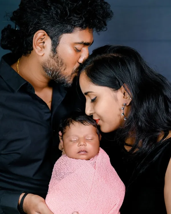 The first family photo. This is such a special moment, with both parents sharing a quiet, loving moment with their newborn. I make sure to capture these connections during every newborn session.