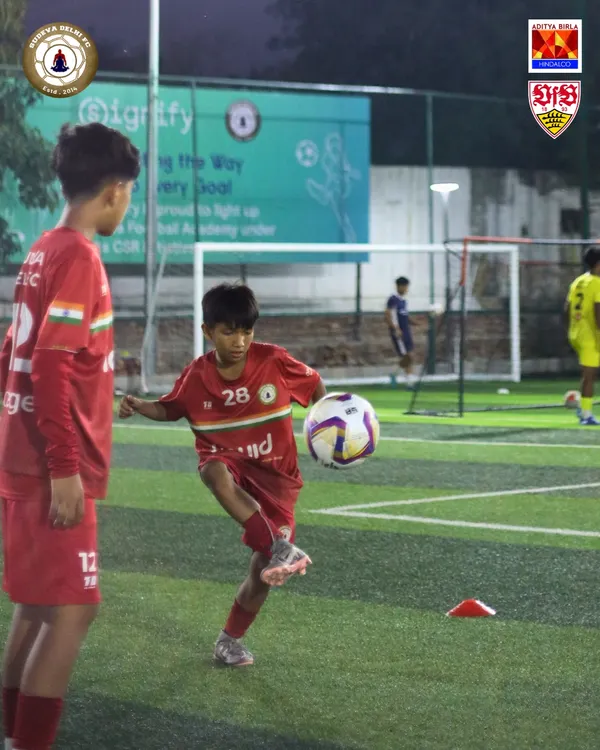 A young player in our red kit perfects his first touch. Mastering ball control is the first step towards becoming a great footballer, and we focus on these fundamentals every single day.