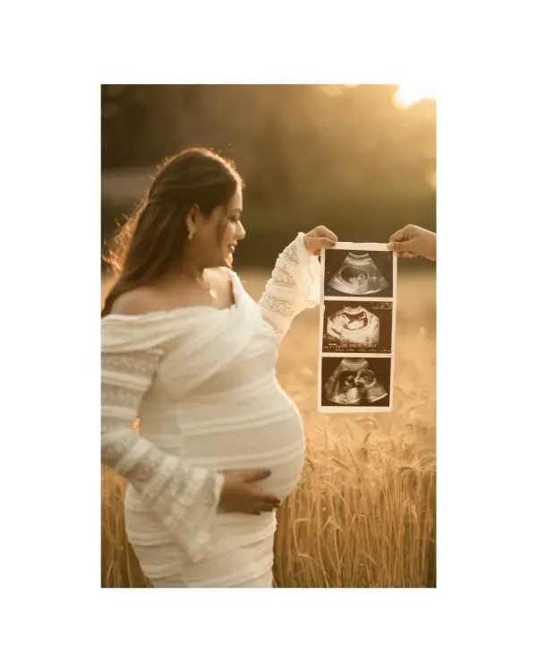 This is the prem ki pehli tasvir, the first picture of your new world. We capture you holding the first glimpse of your baby in a golden wheat field, a setting that reminds us of how Mother Earth nurtures life, just as you do. This is more than a photo; it's a story of connection.