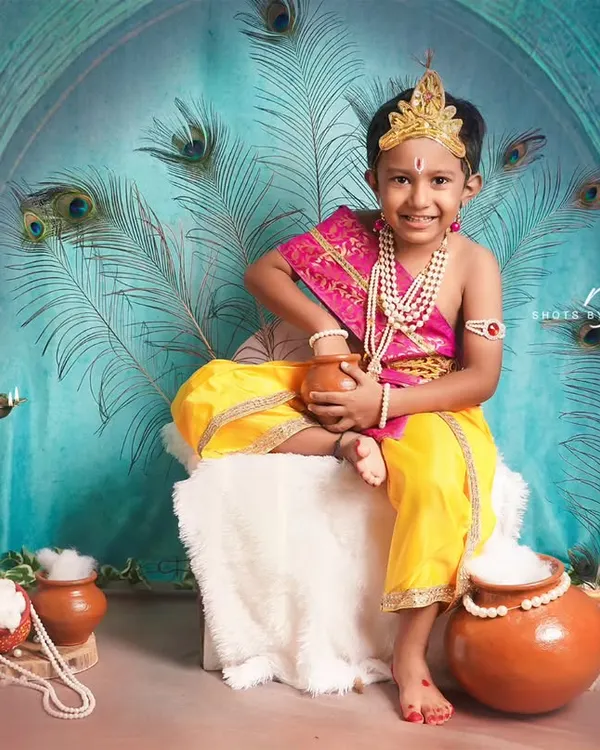 Our little Krishna enjoying his pot of butter. We create detailed and authentic setups for Janmashtami mini-shoots in our studio.