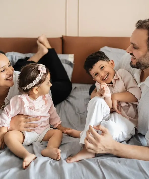 A candid moment of pure joy with this beautiful family of four during a relaxed lifestyle session on the bed. I love capturing these unposed interactions, where the laughter is real and the connections are clear, from the playful tickles to the happy smiles.
