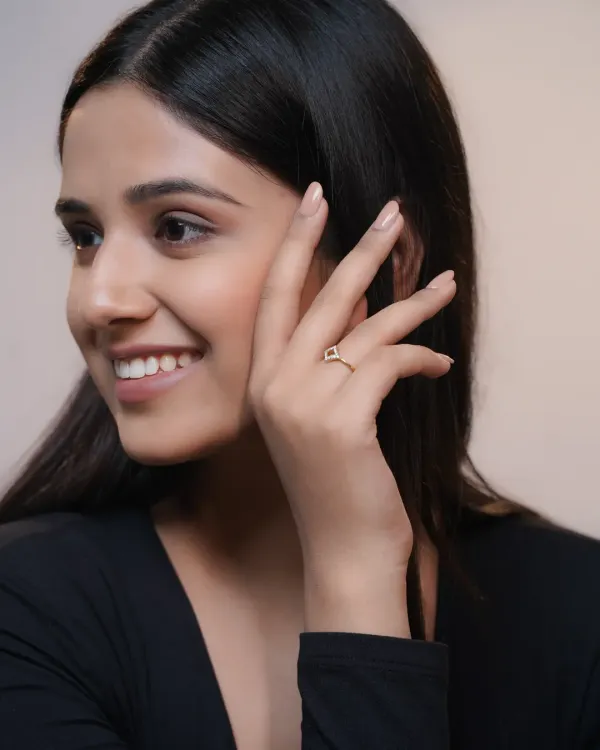 A clean, minimalist shot for the brand Calysta Diamonds, focusing on the delicate design of a modern ring. The image is crafted to highlight the product's elegance for e-commerce use.