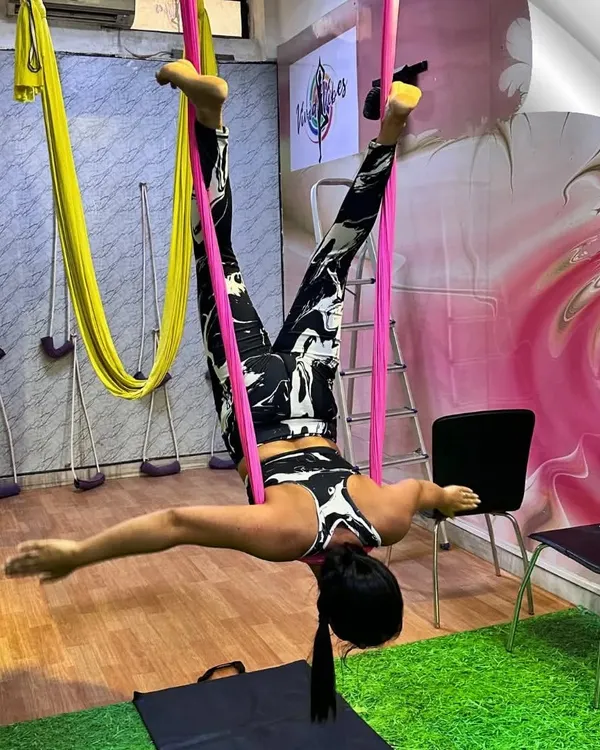 This is the feeling of elevating your practice and finding a new perspective. We love guiding our students to moments like this, where strength, grace, and mindfulness come together in mid-air. This inverted aerial pose is incredible for spinal decompression and building confidence.