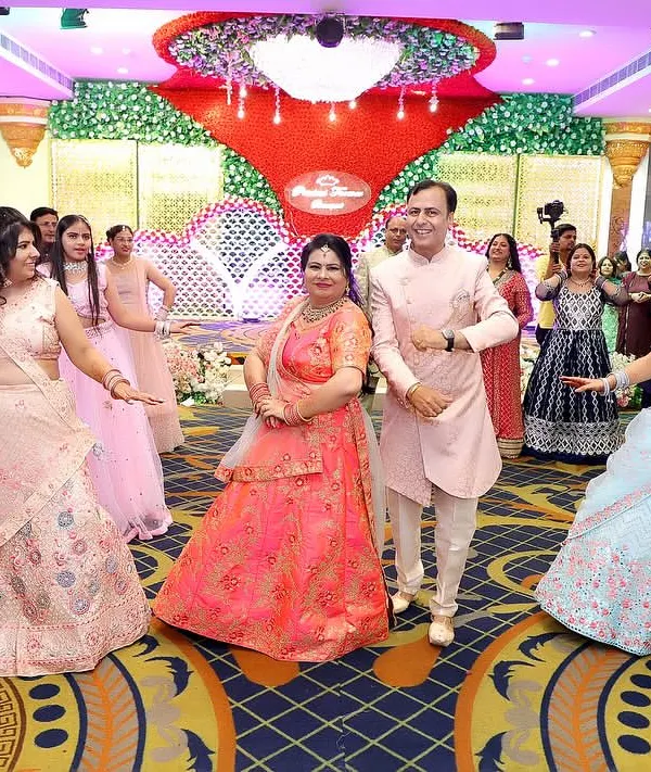 A beautiful moment captured during a family dance performance, with the parents in the center. We design formations that put the most important people in the spotlight.