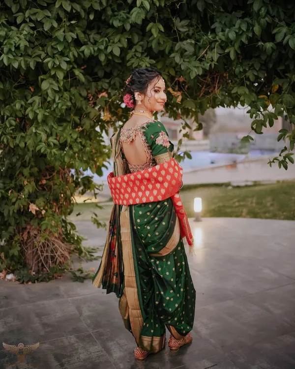 A back shot of my beautiful Maharashtrian bride Vaishnavi. The traditional green Navari saree with the intricate blouse and classic bun adorned with flowers is a look I will always cherish creating.