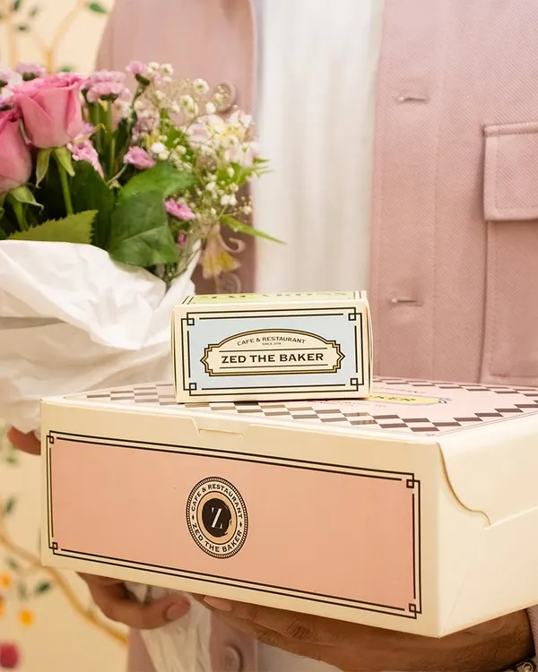The perfect gift is a combination of beauty and taste. Here, a box of my fresh pastries is paired with a beautiful bouquet of flowers, creating a thoughtful and elegant surprise for a loved one.