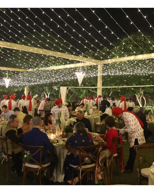 An enchanting outdoor sit-down feast under a canopy of fairy lights. We manage every detail to create a magical ambience for large-scale wedding receptions.