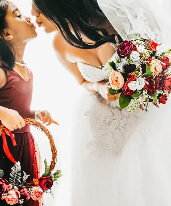 A sweet kiss between the bride and her flower girl. The innocence and love in this moment is what makes having kids at weddings so special.