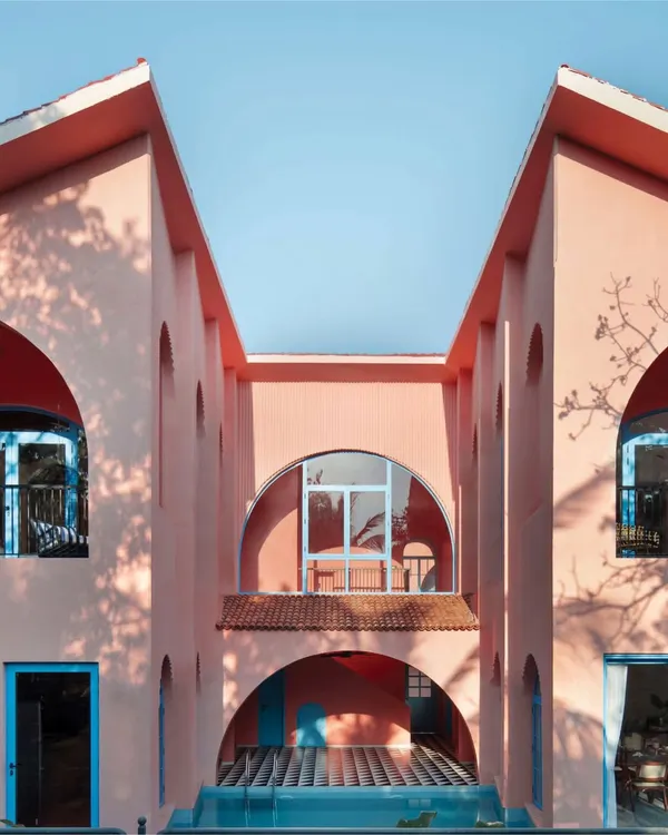 This symmetrical facade of Baia Villas in Goa captures the essence of our design philosophy. It is a conversation between heritage and modernity, using bold color and form to create a space that is both joyful and architecturally significant.