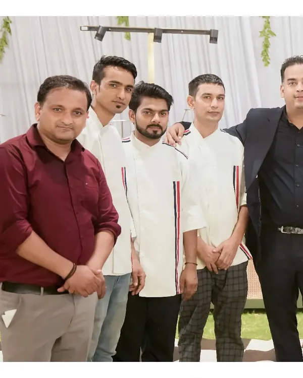 A group photo of our professional service and management team at an event, ready to ensure a seamless experience for our clients.