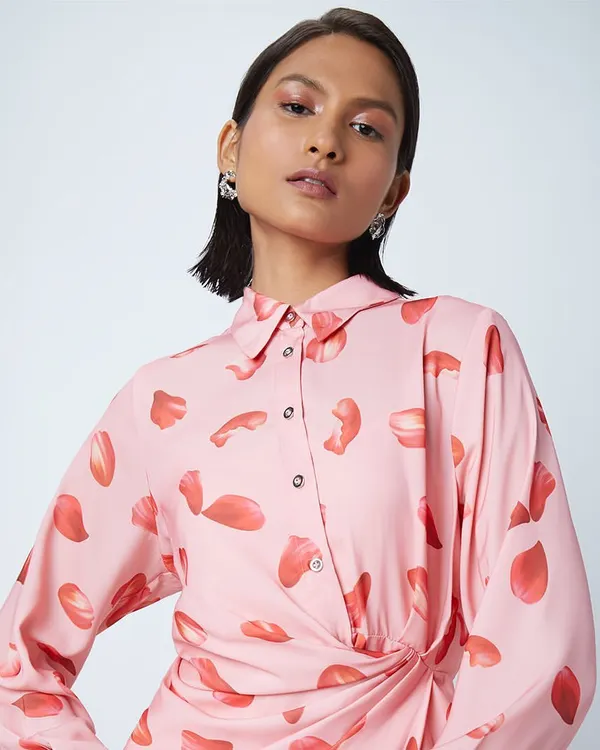 A soft, pretty makeup look for a Westside fashion shoot. The glossy eyes and pink tones complement the printed dress, creating a fresh and modern feel.