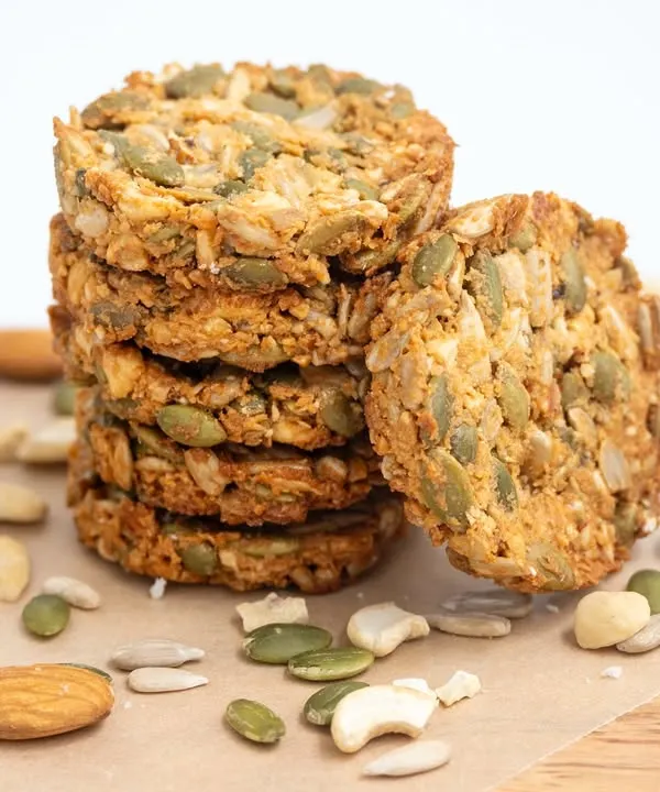 My 7-Seeds Nuts Cookies are a customer favorite for a reason. This shot shows a stack of these healthy cookies, which are loaded with pumpkin seeds, sunflower seeds, almonds, and cashews.