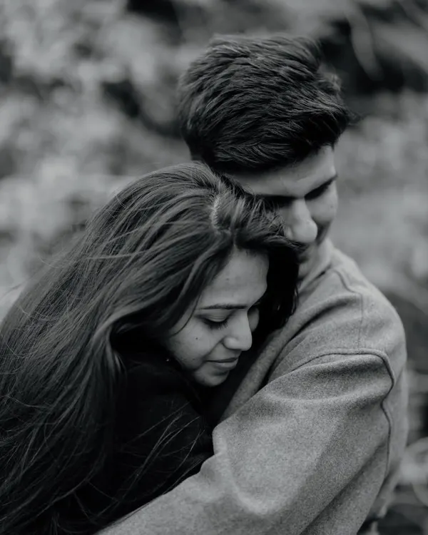 A close, tender hug in the cool air of Ladakh. This black and white portrait focuses on the warmth and comfort the couple finds in each other, even in a rugged, remote landscape.