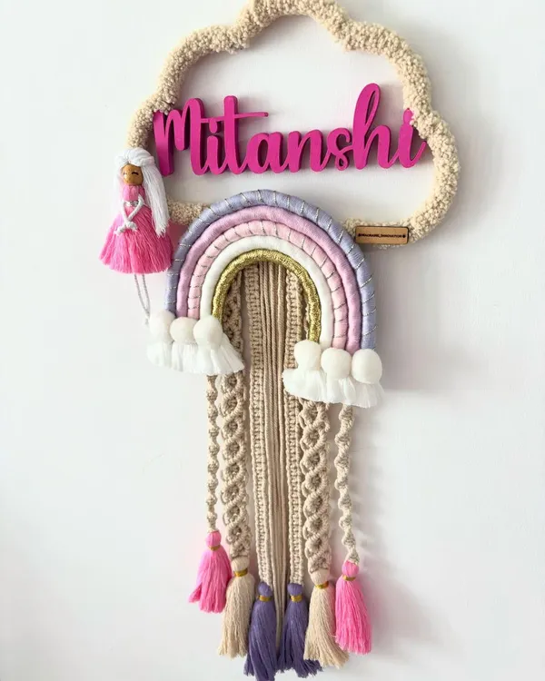 This custom name dream catcher is one of my favorite things to make. Seeing a child's name woven into a design with their favorite colors is just magical, and it makes for a truly personal gift for a nursery or kid's room.