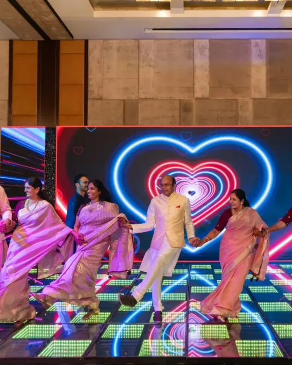 A beautiful family performance with a heart-themed LED background. I love choreographing large family numbers that showcase unity and love.