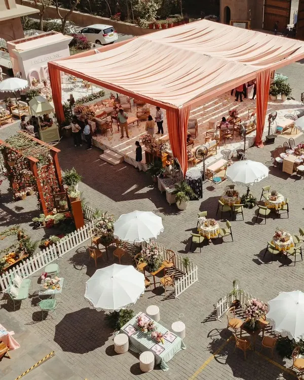 An aerial view of the Parisian Market-themed Mehendi I designed. The layout included various stalls and seating areas to encourage guests to explore and interact.