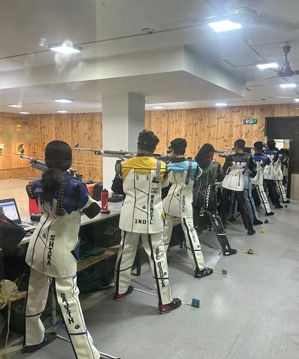A wide view of our 10m shooting range, where athletes are engaged in a focused training session. Each lane is equipped with advanced electronic targets to track performance with precision.