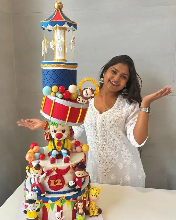 Here I am with one of my proudest creations, a massive, multi-tiered circus-themed cake. This photo was taken to celebrate 6 years of Say Aa Cakes, a journey of turning my passion for edible art into a reality.