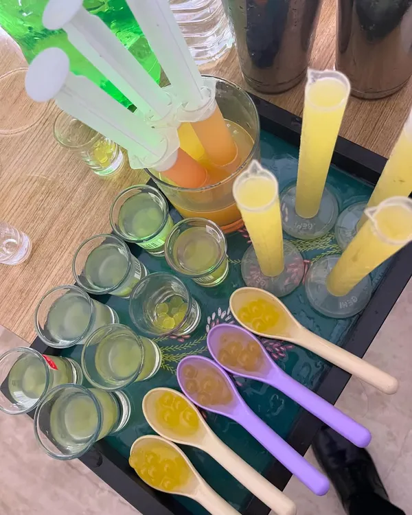 A tray of our most creative offerings: injection shooters, tumbler shots, and "spooner kavias". These are perfect for adding a fun, interactive element to your party.
