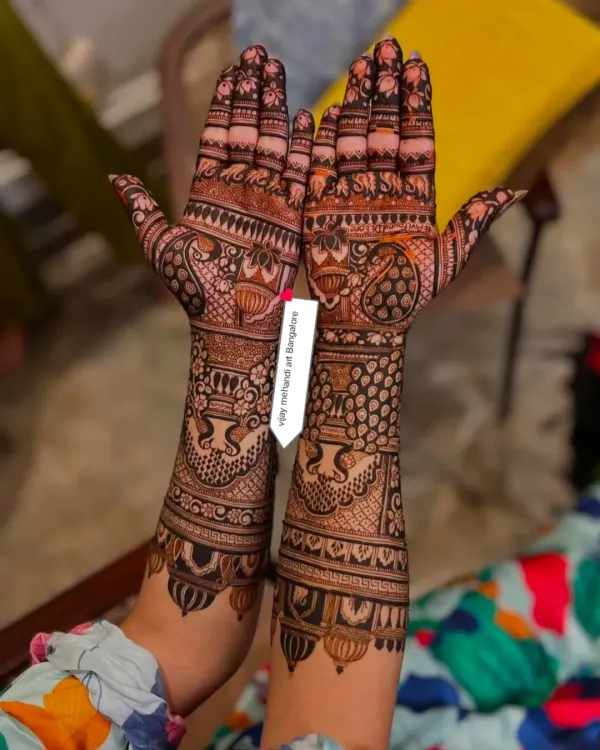 A beautiful, classic bridal mehndi design with full coverage and intricate details.