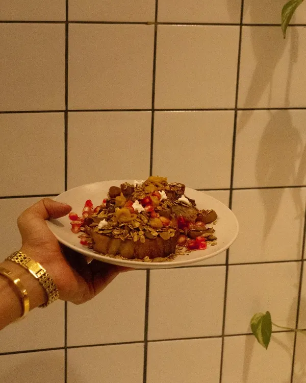 Our cinnamon French toast, topped with kaya jam and house-made granola. It is soft, crisp, and just sweet enough.