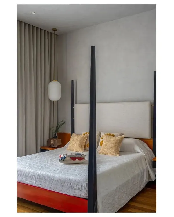 This four-poster bed was custom designed with a lacquered wood frame inspired by Channapatna crafts. The clean lines and bold color make it a modern heirloom piece that tells a personal story.