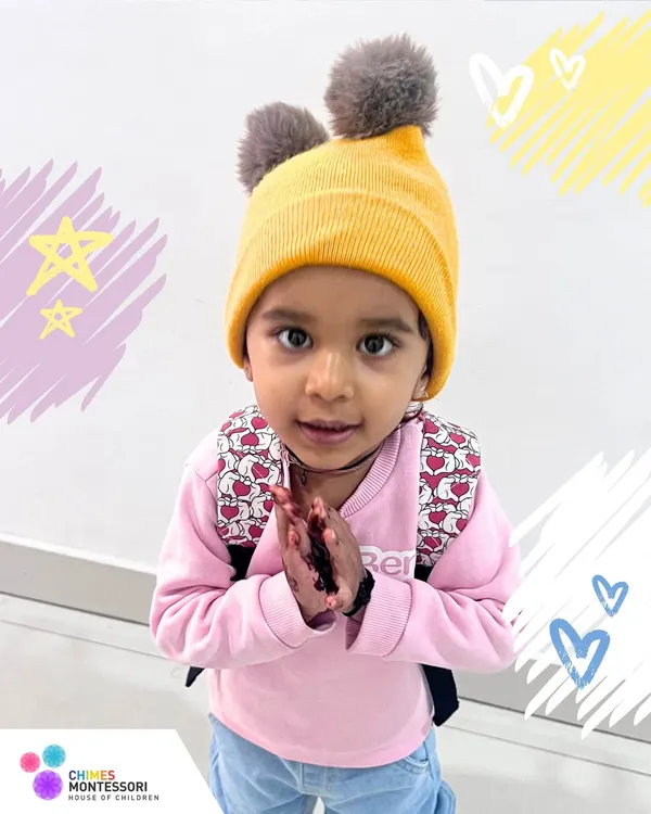 Every child is a star in our story. This little one, with her warm hat and welcoming gesture, embodies the sweet and gentle nature of our school community.