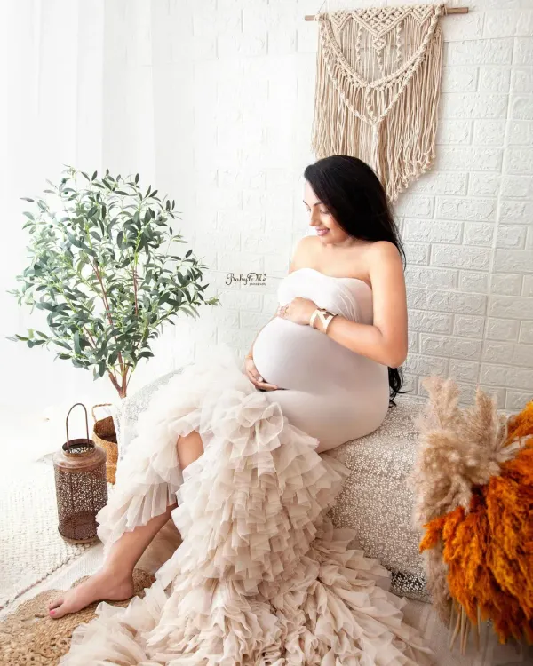 This mama looks so serene and beautiful in my boho setup. The ruffled white mermaid gown is available in my studio and adds such a lovely, soft texture to the photos.