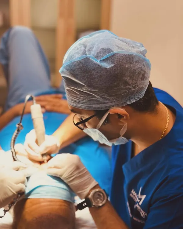 This is where the art and science of hair restoration meet. Performing an FUE procedure requires immense focus and dedication. I see each surgery as a disciplined craft, or 'sādhanam', aimed at achieving the best possible outcome for my patient.