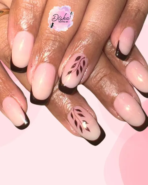 Nude and black is always a power combo. This elegant design features a modern French tip with delicate, hand-painted leaves on the accent nails.