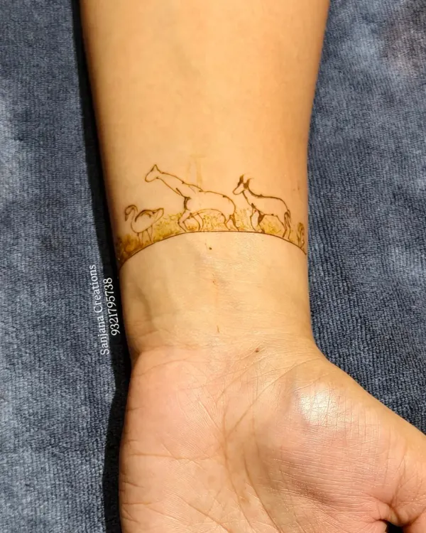 A close-up of a unique baby shower wristband design. This one features a giraffe, a duck, and a deer, showcasing how we can create personalized and themed art.