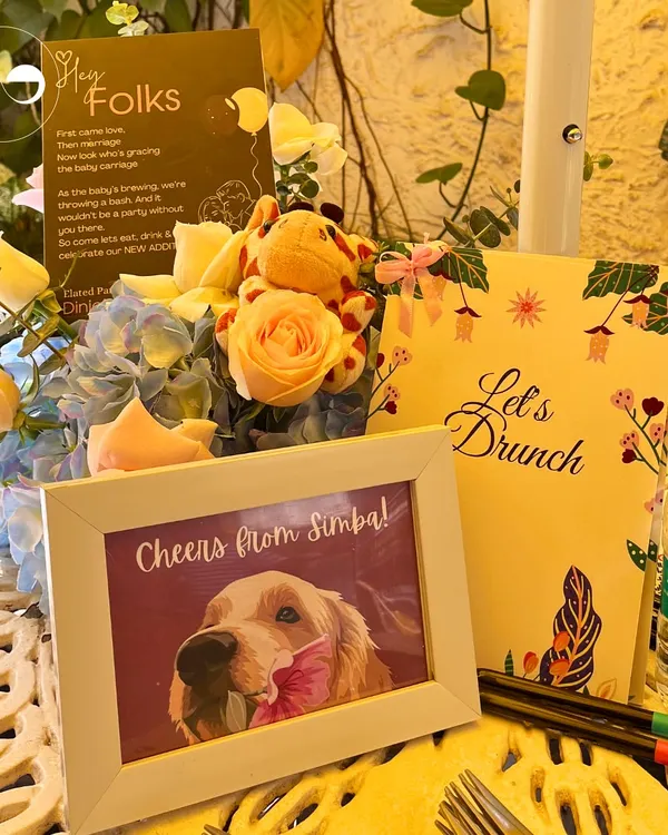 I believe in making every detail personal. This custom table setting includes a framed photo of the family's beloved pet, showing how I incorporate unique, meaningful touches that tell your family's story.