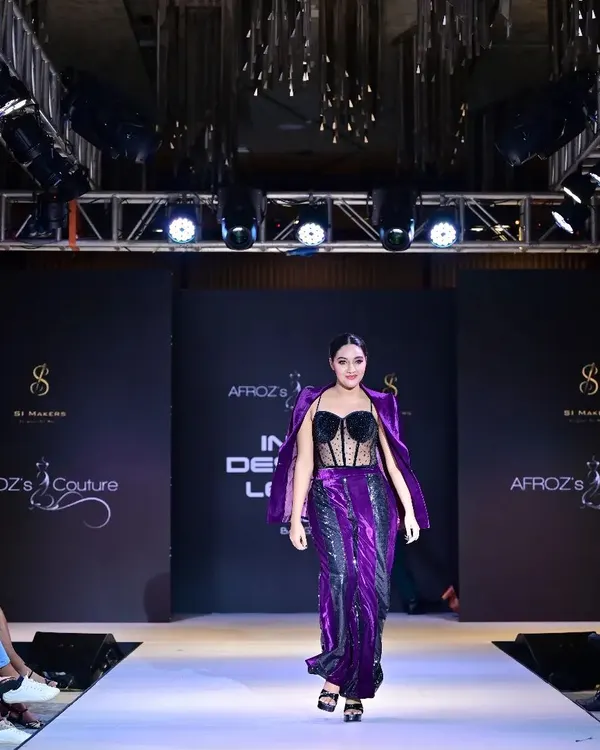 A powerful moment on the runway for the Indian Designer League. I ensure every detail, from the dramatic lighting to the model's confident walk, is perfectly executed to showcase the designer's vision.