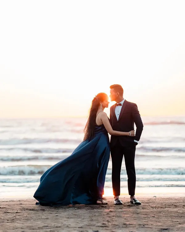 A perfect silhouette against the sunset for a pre-wedding shoot. I love using natural light to create these romantic, film-like moments for couples on the beach.