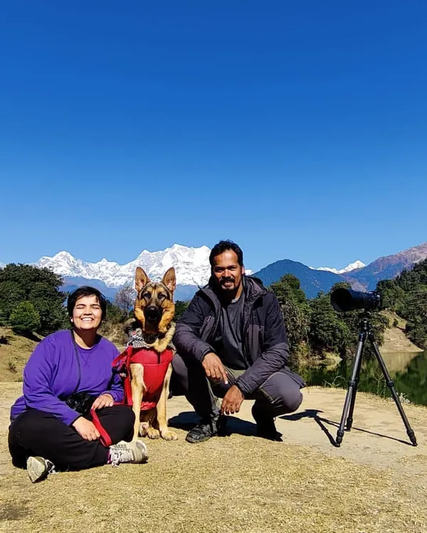 A family portrait with our dog Jiraiya during a trip to Chopta, with the Himalayan peaks creating a breathtaking background. These pet-inclusive vacation sessions are my specialty, capturing your whole family on your greatest adventures.