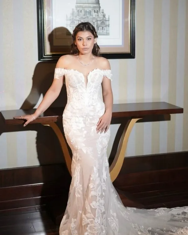 The epitome of a modern Catholic bride. We opted for soft, romantic waves and a clean, radiant makeup look to complement her beautiful off-the-shoulder lace gown.