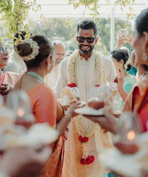 The groom's grand entrance, surrounded by family in a traditional welcoming ritual. I coordinate every part of the ceremony to ensure it flows smoothly and joyfully.